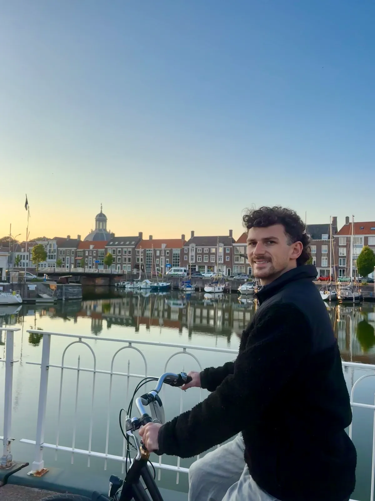 Chase biking by the water in the Netherlands